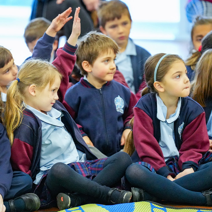Students sitting on the floor together St Finbar’s Catholic Primary Glenbrook